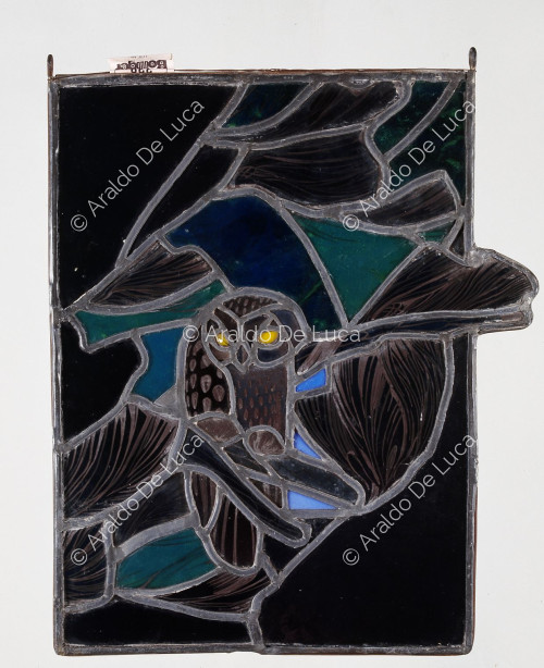 Stained glass window with owl. Detail