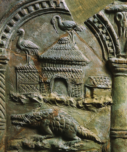 Relief with houses and flamingos. Detail