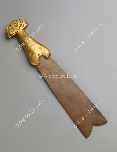 Knife with gold handle