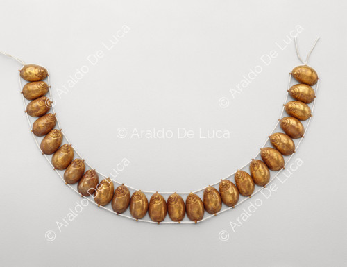 Necklace with shell-shaped beads