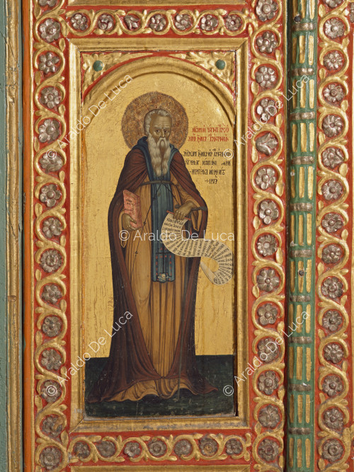 Tabernacle with painted wooden doors. Detail with Saint