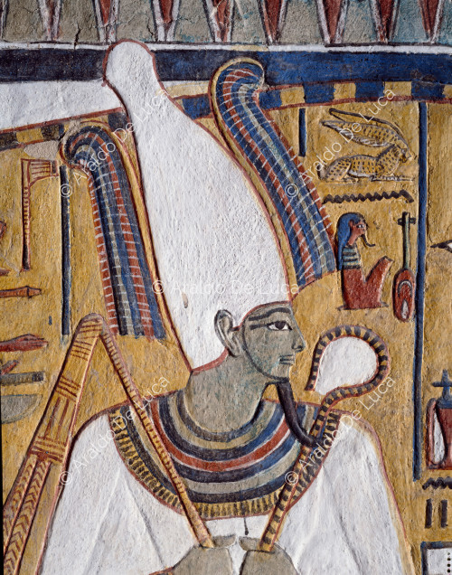 The god Osiris with the crown Atef and symbols of power