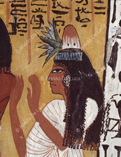 Detalle del muro nº 10 de la cámara funeraria de la tumba de Sennedjem. Sennedjem y su esposa adoran a los espíritus de las cinco estrellas. Detalle que muestra a Lyneferti, la esposa de Sennedjem, con el cono de ungüento en el pelo y el tallo de loto.