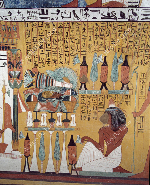 Detalle de la escena de ofrenda al dios Osiris: Sennedjem está arrodillado detrás de la mesa de ofrendas llena de alimentos y vasijas colocadas delante del dios.