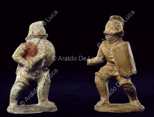Pair of fictile statuettes of gladiators